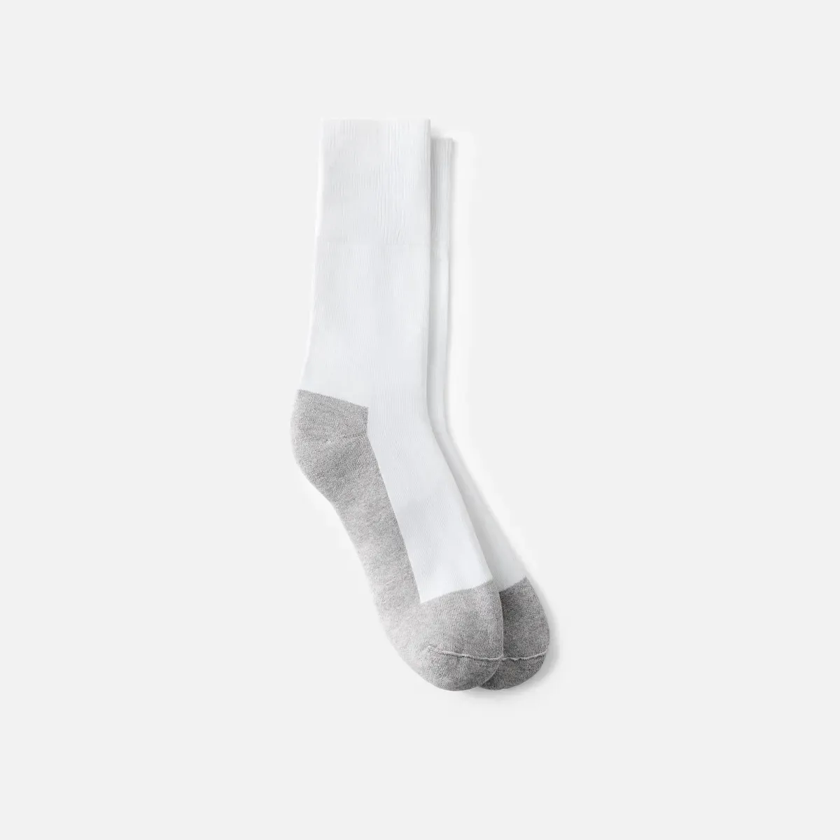 Key features of diabetic crew socks displayed on stone surface